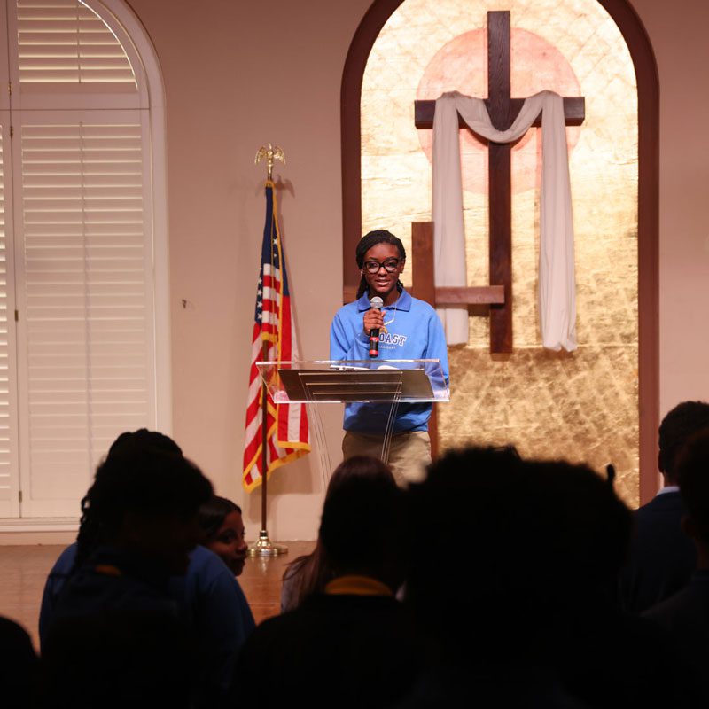 A Seacoast student speaking at a chapel service
